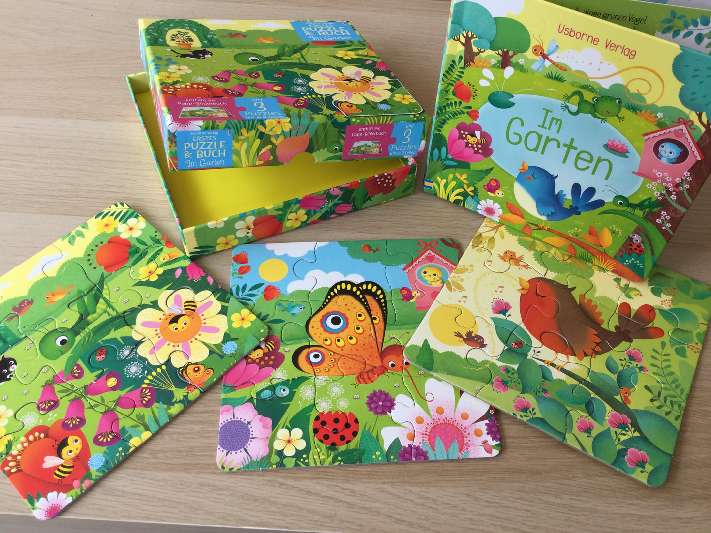 "Erstes Puzzle & Buch: Im Garten". Puzzle y libro alemán
